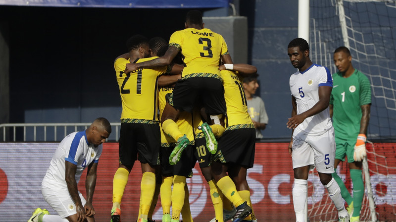 Jamaikas izlases futbolisti līksmo pēc otrā vārtu guvuma
Foto: Gregory Bull/AP/Scanpix