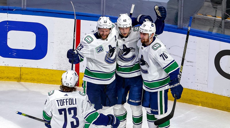 Vankūveras "Canucks" svin vārtu guvumu. Foto: AFP/Scanpix